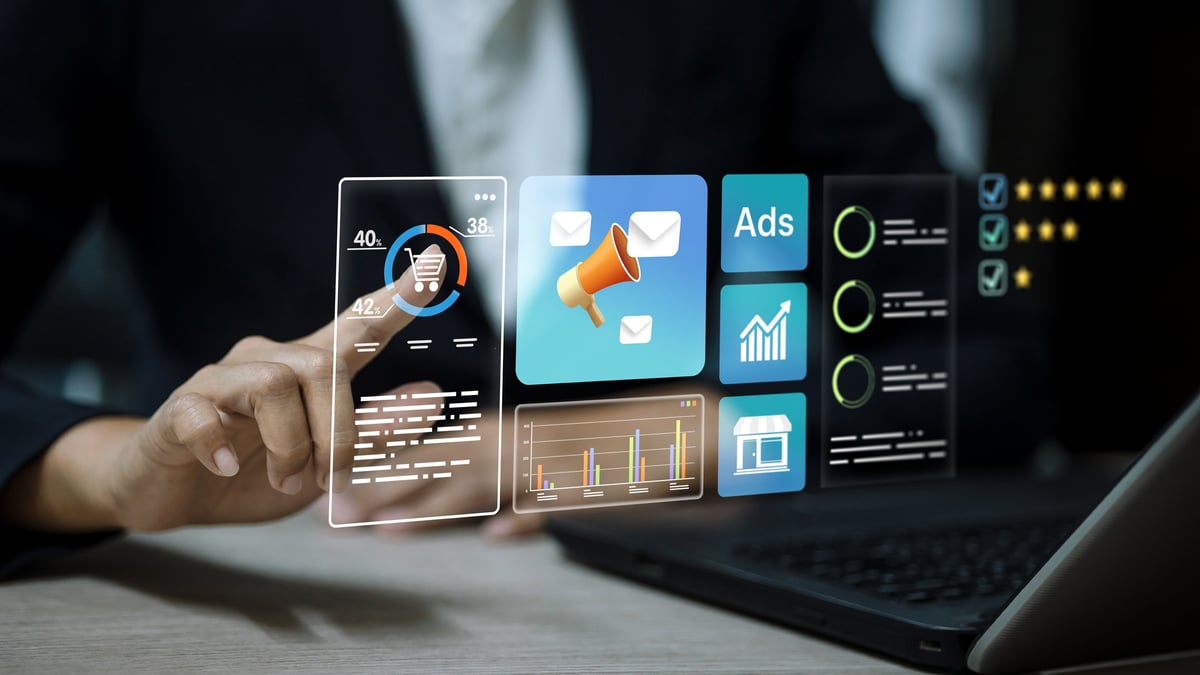 Professional reviewing an integrated marketing and sales analytics interface